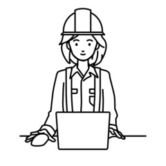 デスクで座ってPCを使っている工事現場の女性