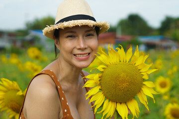 Asian Woman 40s LGBT transgender express feeling Happy Smile fun under sunshine in Sunflower yellow