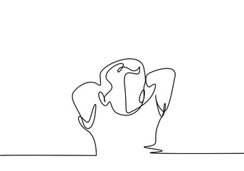 little boy stands relaxed with his hands behind his head