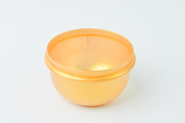 Yellow plastic bowl isolated on a white background