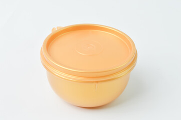 Yellow plastic bowl isolated on a white background