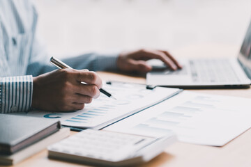 Business people working with graphs, business documents on their desks to analyze for business startups.