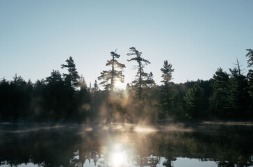fog on the lake during sunrise