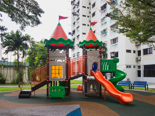 A children's playground in a residential neighbourhood. Playground designed like a castle for children.