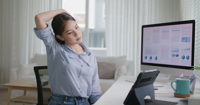 Asia people young woman worker work at home job video call telemedicine online clinic app for workforce care meet chat or tele consult to doctor remote advice teach to relax stiff neck or wrist pain.