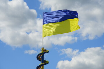 Ukrainian flag on sky clouds