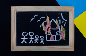 conceptual image with Ukrainian flag colors and children’s drawing illustrating, war, refugees and loss