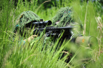 Sniper was waiting in ambush behind a tree