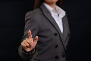 Attractive professional business woman hands standing and pointing something with confident for advertising on black background isolated