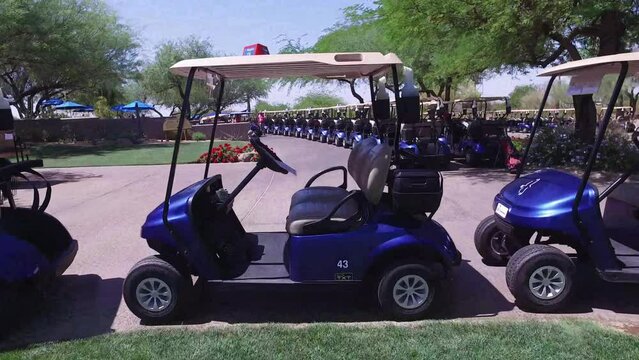 Travel through the opening in a golf cart at the Greyhawk Golf Course, Scottsdale, Arizona.