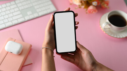 Close-up, Female hand holding phone white screen mockup