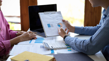 Financial analysts team looking at the financial and management data