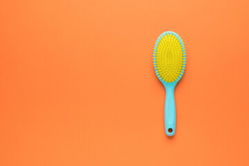 Yellow-blue comb on an orange background. Space for text.