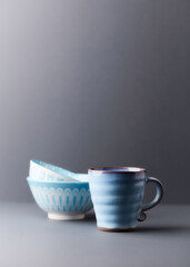 Traditional, handcrafted ceramic on gray background. Soft focus. Copy space.