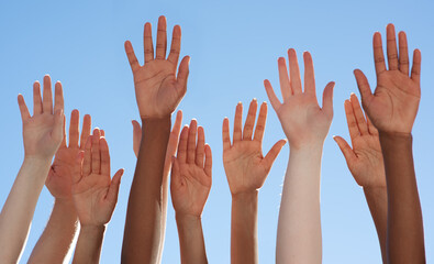 Solidarity through diversity. Cropped shot of a diverse group of people raising their hands. - obrazy, fototapety, plakaty