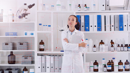 I hope my findings lead to something great. Shot of a young scientist looking at the notes written on a glass wall in a lab.