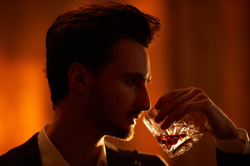 brunet man drinking whiskey