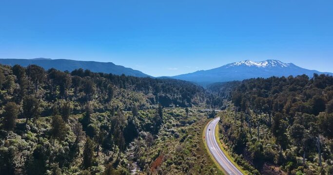 Flight from Makatote viaduct towards Mount Ruapehu over state highway - NZ