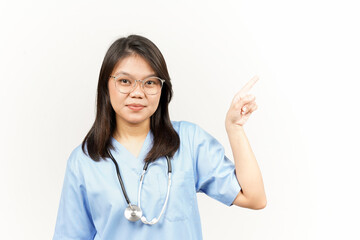 Showing Product and Pointing Side Of Asian Young Doctor Isolated On White Background