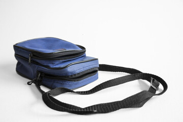 80s style 35mm auto camera blue portable bag on white background