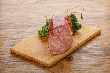 Pork ham sausage over board