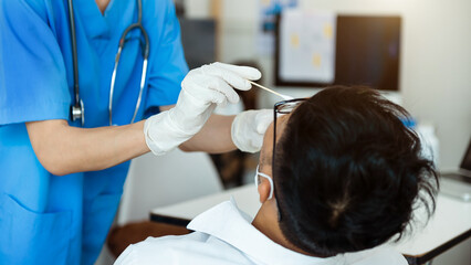  Doctor doing Covid-19 or Coronavirus test or DNA test to a young woman with nasal swab probe, .