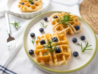 Delicious homemade waffle toping with blueberries