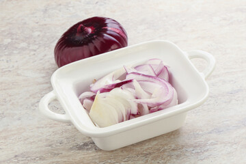 Sliced red onion in the bowl