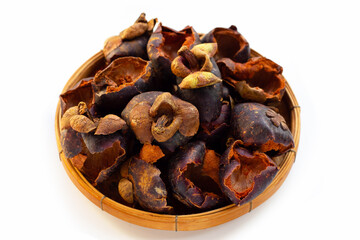 Dried mangosteen peel on white background.