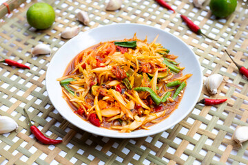 Spicy papaya salad with pickled shells