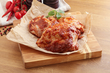 Marinated chicken leg in tomato sauce