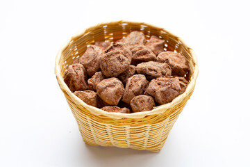 Dried salted Chinese plum on white background