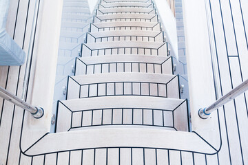 Teak stairs descending on a luxury yacht.