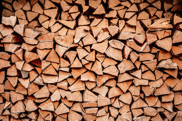 Dry chopped firewood logs. Wooden pile texture. stacked wood