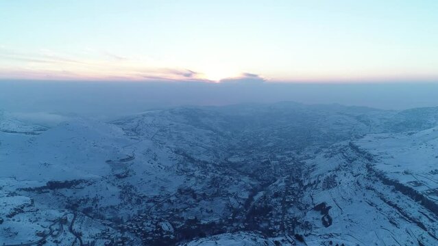 Faraya mountainous valley covered with snow at dusk, Aerial of Lebanon