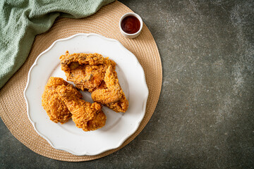 fried chicken with ketchup on plate