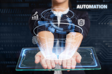 Business, Technology, Internet and network concept. Young businessman working on a virtual screen of the future and sees the inscription: Automation