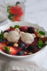 Homemade dessert snack. Smoothie Bowl with Frozen Mixed Berries and Nuts with Almond Flavored Jelly. Ideal for adults and children refreshing sweet delicacy.