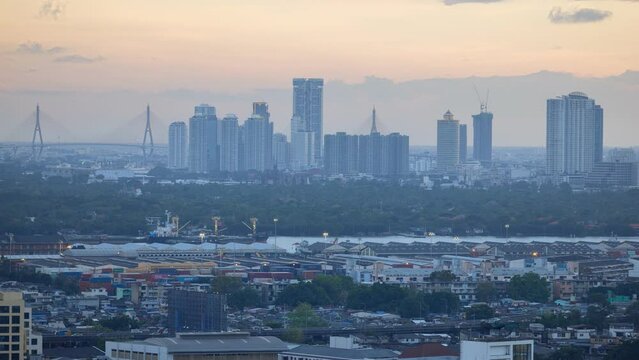 Aerial view of Thonglor junction with cars traffic skyscraper buildings. Bangkok City in downtown at night, Thailand 