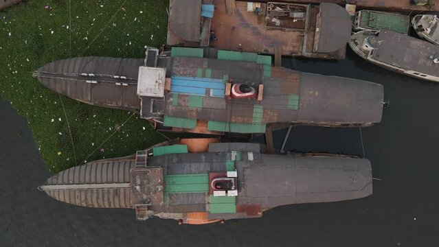 Aerial drone vertical view of two rocket paddle steamers statics in the waters of Dhaka, Bangladesh