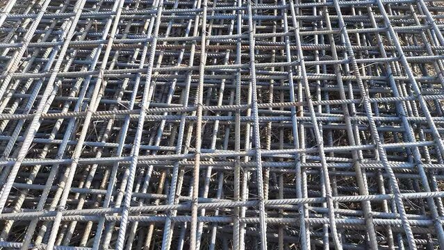 Steel wire reinforcement for the foundation. Steel bar iron wire in the factory.Steel Rebars for a reinforced concrete construction site.Steel reinforcement bar for industrial building -Camera Moving