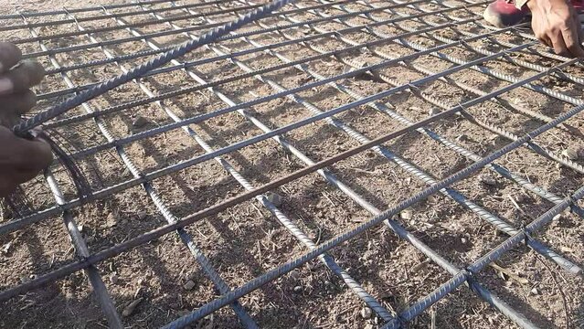 The rebar is bonded with steel wire for use as a construction infrastructure. Installation Of Reinforcement Steel Bars For Footing Strap Beam Raft Slab - All Structural Concrete.