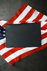 Obraz premium American flag on a gray background. Military background with bullets. USA and EU collective west.