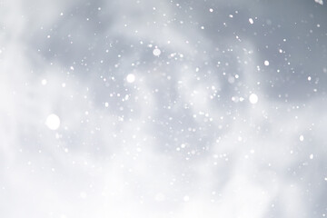 Fototapeta premium blue snowfall bokeh background, abstract snowflake background on blurred abstract blue