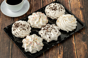 meringue cookies or beze cookies with candy and chocolate - obrazy, fototapety, plakaty