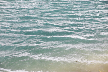 Water surface. The texture of the water. Waves on the lake in windy weather.
