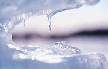 Obraz na płótnie Canvas Texture of ice on a spring day under the sun.