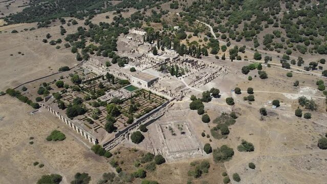 Aerial drone view of the Caliphate City of Medina Azahara in Cordoba . Archaeological site. Unesco World Heritage, Spain. Ancient civilization. Historic place. Touristic destination for holidays. 
