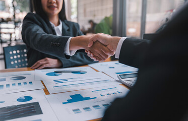 business executives partnership handshaking agreement to become a partner, collaborative teamwork. Finishing up a conversation after collaboration