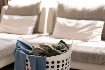 clothes in the basket before fold in living room at home
